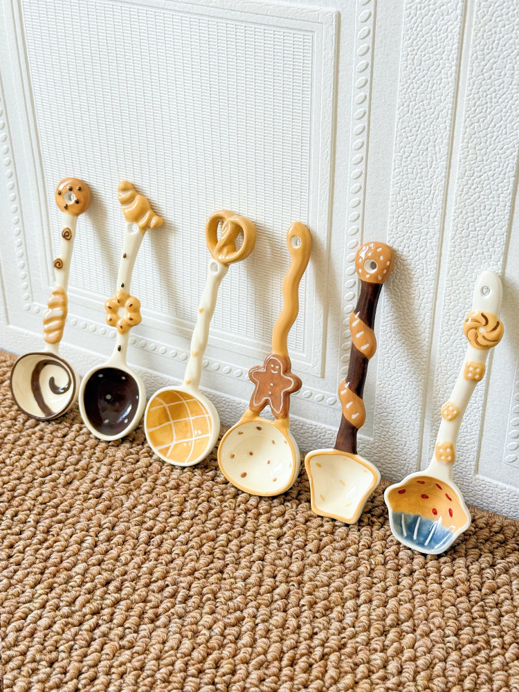 Collection of cute ceramic spoons featuring different playful food-inspired designs