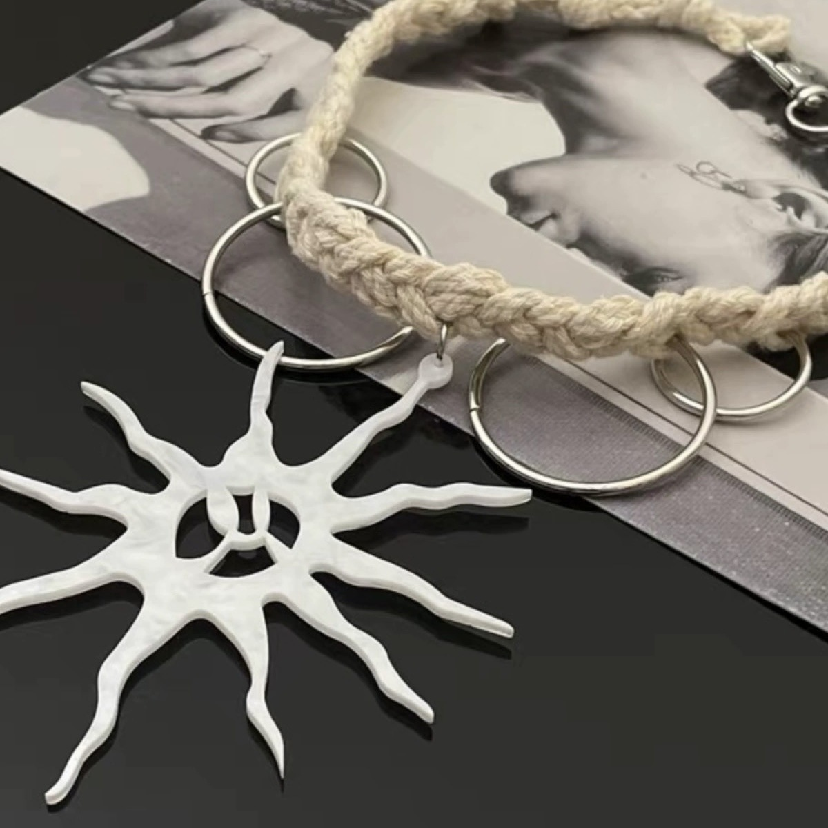 Close-up of textured sun pendant with an irregular rays design and distinctive surface details