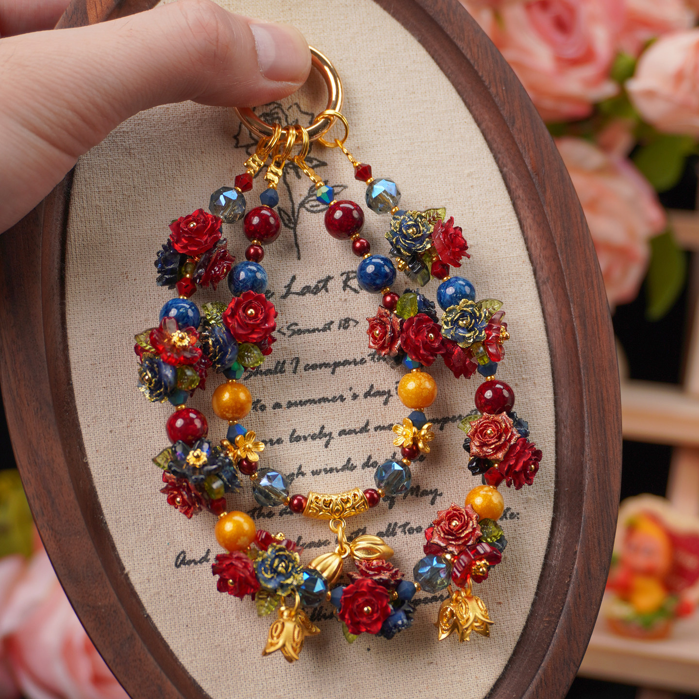 Vintage flower phone charm with colorful beads, rose details and gold-tone decorative accents
