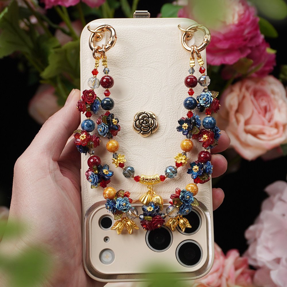 Colorful floral phone charm with layered roses, beads and decorative accents