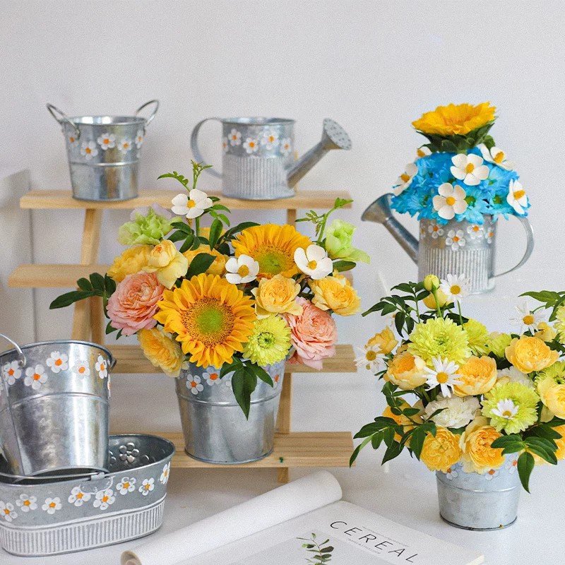 Daisy-print metal planter styled as rustic home and garden decor
